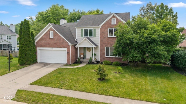 14492 Cotswold Ln, Carmel, IN 46033 - traditional home with brick siding, driveway, a chimney, and a garage