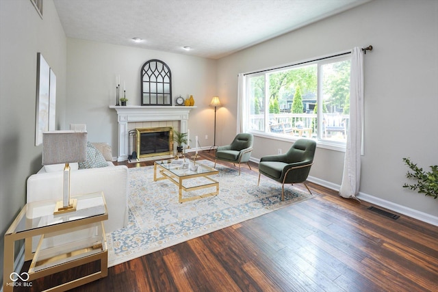 14492 Cotswold Ln, Carmel, IN 46033 - living room with wood finished floors, a fireplace, and a textured ceiling