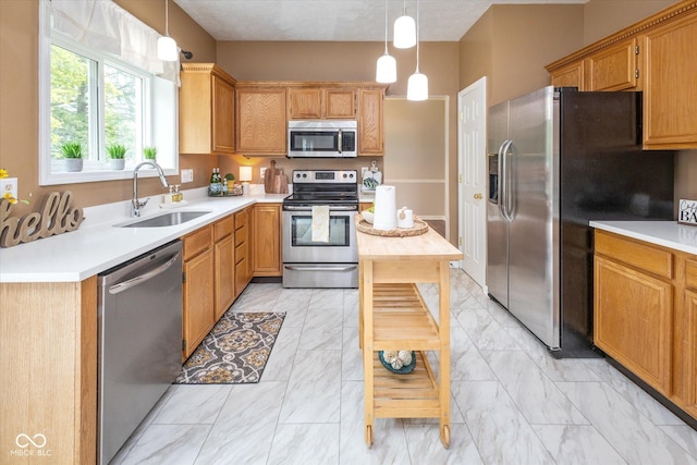 14492 Cotswold Ln, Carmel, IN 46033 - kitchen with stainless steel appliances, light marble finish floors, light countertops, and pendant lighting