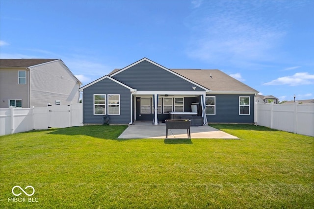 4420 Wild Turkey Dr, Indianapolis, IN 46239 - back of property with a hot tub, a patio, and a fenced backyard
