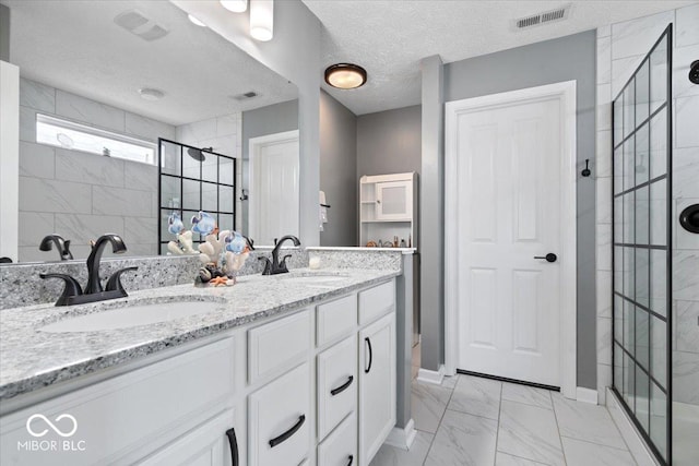 4420 Wild Turkey Dr, Indianapolis, IN 46239 - bathroom featuring a stall shower, marble look tile flooring, double vanity, and a textured ceiling
