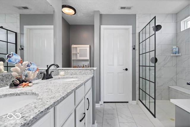 4420 Wild Turkey Dr, Indianapolis, IN 46239 - full bathroom featuring marble finish floors, a shower stall, double vanity, and a textured ceiling