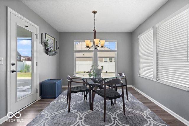 4420 Wild Turkey Dr, Indianapolis, IN 46239 - dining space featuring a chandelier and dark wood-type flooring