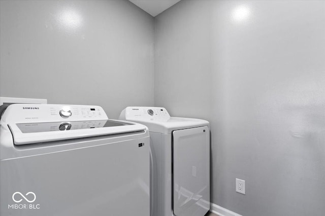 4420 Wild Turkey Dr, Indianapolis, IN 46239 - laundry room with washer and dryer and baseboards