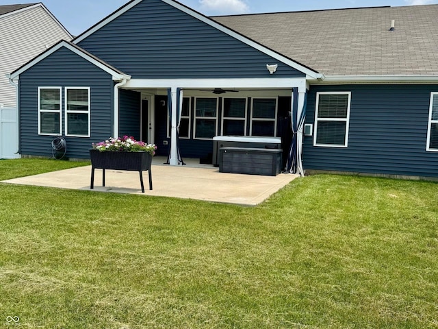 4420 Wild Turkey Dr, Indianapolis, IN 46239 - back of property with a patio, a hot tub, a yard, and a shingled roof
