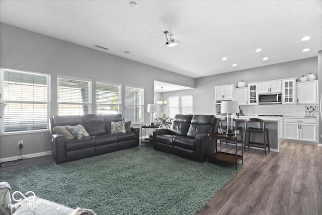 4420 Wild Turkey Dr, Indianapolis, IN 46239 - living area with a textured ceiling, dark wood-type flooring, recessed lighting, and a chandelier