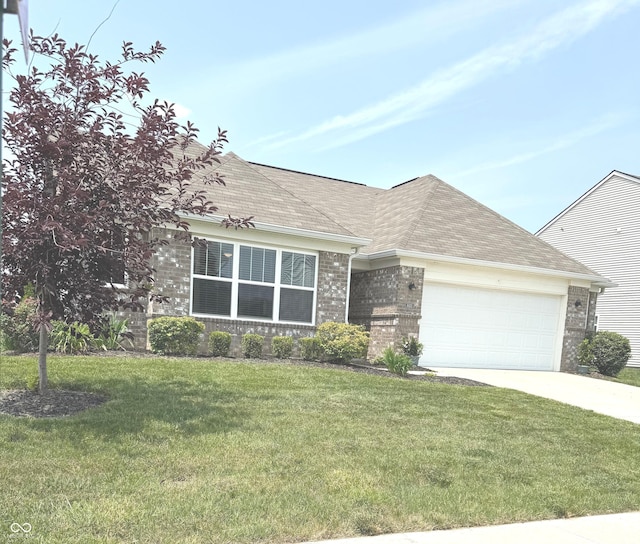 4420 Wild Turkey Dr, Indianapolis, IN 46239 - view of front of property featuring an attached garage, brick siding, driveway, and a front lawn