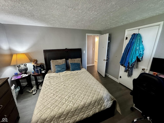 306 Waynetown Rd, Crawfordsville, IN 47933 - bedroom with a textured ceiling and dark wood-type flooring