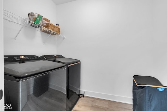 1834 Rosette Way, Indianapolis, IN 46202 - washroom with washing machine and clothes dryer and wood finished floors