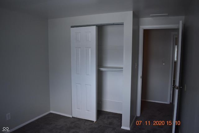 9016 Neptune Dr, Indianapolis, IN 46229 - unfurnished bedroom with dark carpet and a closet
