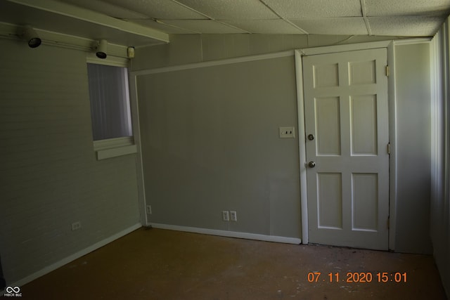9016 Neptune Dr, Indianapolis, IN 46229 - spare room with a paneled ceiling and concrete floors
