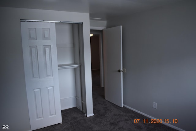 9016 Neptune Dr, Indianapolis, IN 46229 - unfurnished bedroom with dark colored carpet and a closet