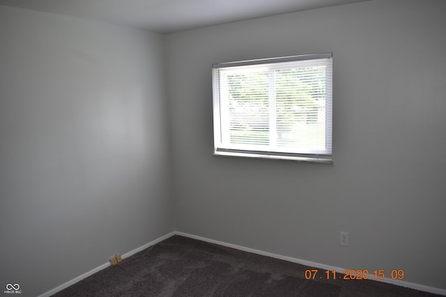 9016 Neptune Dr, Indianapolis, IN 46229 - spare room featuring dark carpet and baseboards