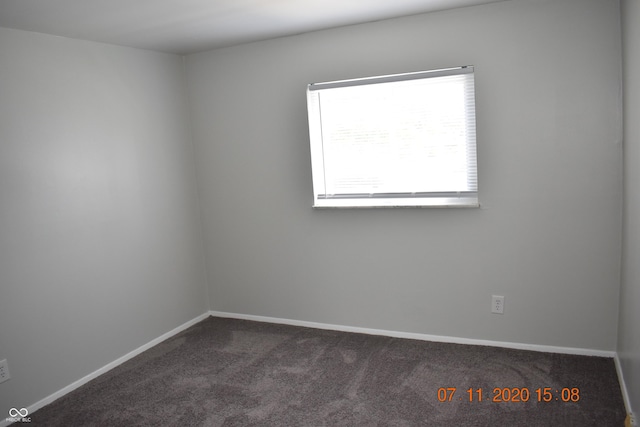 9016 Neptune Dr, Indianapolis, IN 46229 - empty room featuring dark colored carpet and baseboards