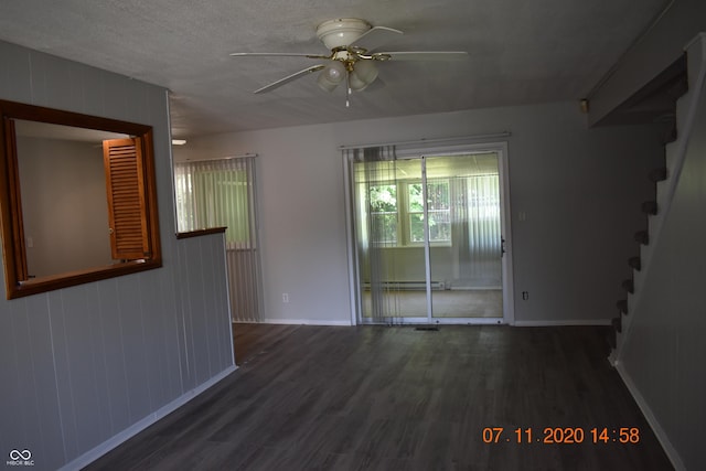 9016 Neptune Dr, Indianapolis, IN 46229 - unfurnished room featuring ceiling fan, wood finished floors, and stairs
