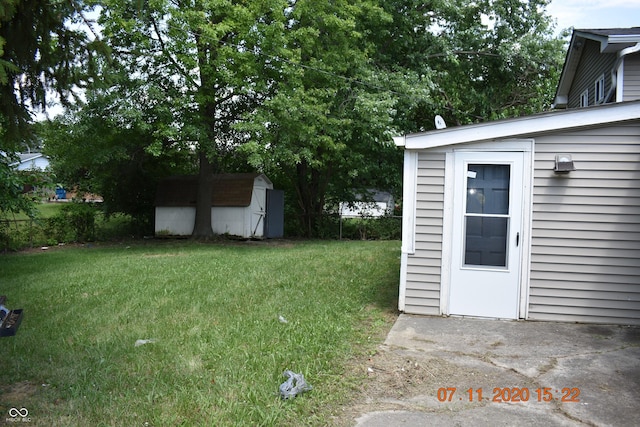 9016 Neptune Dr, Indianapolis, IN 46229 - view of grassy yard with a storage shed