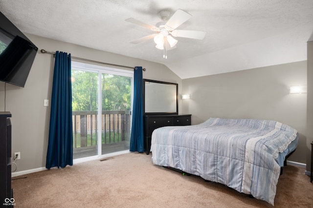 1031 Lancashire Ln, Pendleton, IN 46064 - carpeted bedroom featuring access to exterior, vaulted ceiling, a ceiling fan, and a textured ceiling