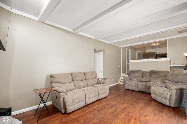 1031 Lancashire Ln, Pendleton, IN 46064 - living area featuring beamed ceiling, wood finished floors, and a textured ceiling