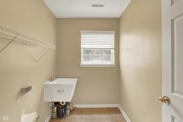 12322 Cool Winds Way W, Fishers, IN 46037 - washroom with baseboards and tile patterned floors
