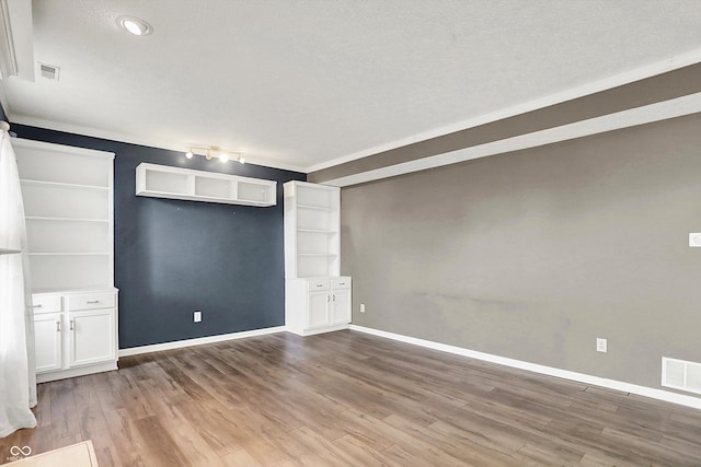 12322 Cool Winds Way W, Fishers, IN 46037 - empty room featuring wood finished floors and a textured ceiling