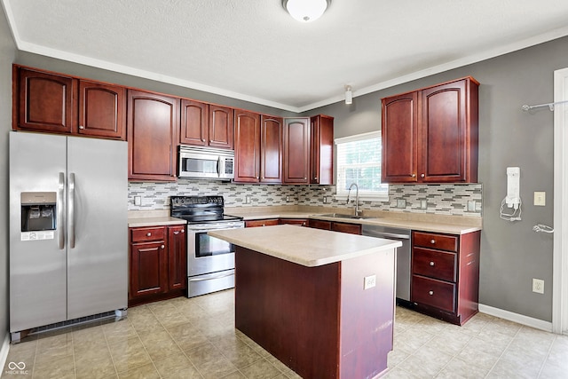 12322 Cool Winds Way W, Fishers, IN 46037 - kitchen with appliances with stainless steel finishes, reddish brown cabinets, light countertops, tasteful backsplash, and ornamental molding