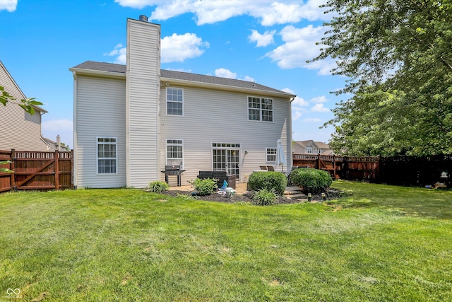 12322 Cool Winds Way W, Fishers, IN 46037 - rear view of property with a fenced backyard and a chimney