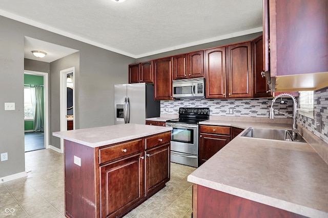 12322 Cool Winds Way W, Fishers, IN 46037 - kitchen with stainless steel appliances, backsplash, healthy amount of natural light, crown molding, and a textured ceiling
