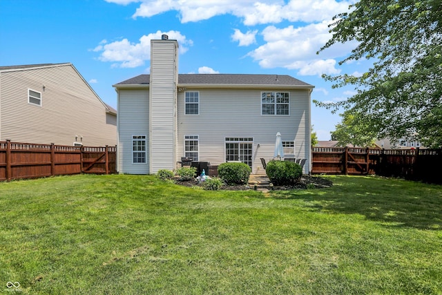 12322 Cool Winds Way W, Fishers, IN 46037 - back of property with a fenced backyard and a chimney