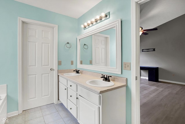 12322 Cool Winds Way W, Fishers, IN 46037 - bathroom featuring double vanity, a bath, a ceiling fan, and tile patterned flooring