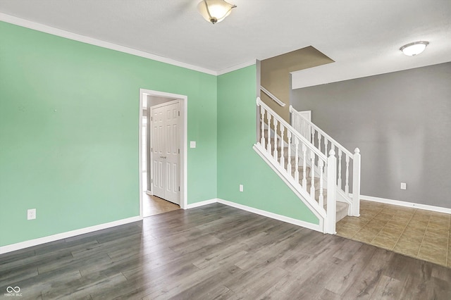 12322 Cool Winds Way W, Fishers, IN 46037 - unfurnished room featuring wood finished floors, stairs, and crown molding