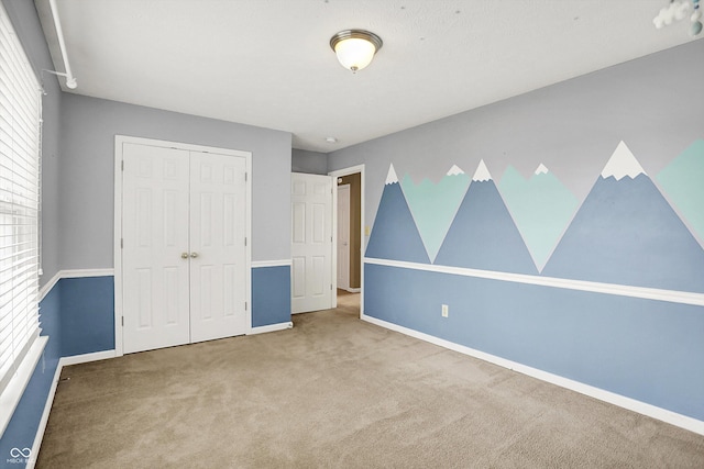 12322 Cool Winds Way W, Fishers, IN 46037 - unfurnished bedroom featuring carpet floors and a closet