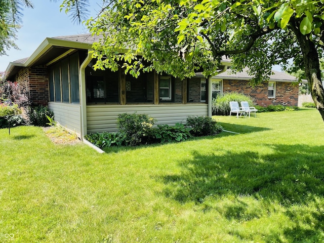 1008 Whispering Trl, Greenfield, IN 46140 - view of home's exterior with a lawn and brick siding