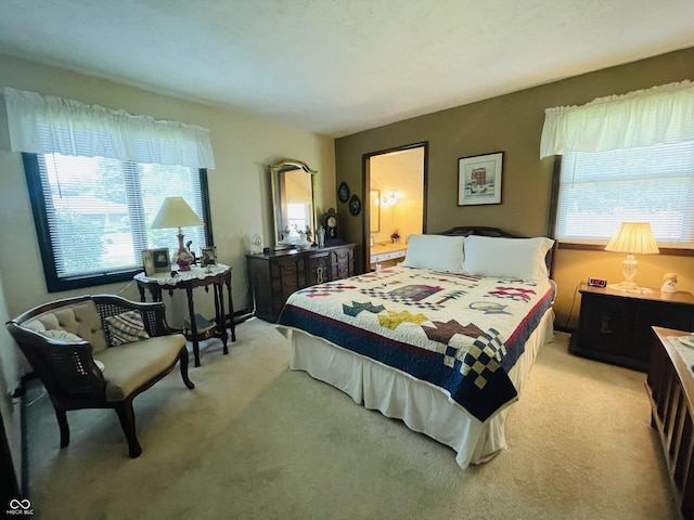 1008 Whispering Trl, Greenfield, IN 46140 - bedroom with light carpet and ensuite bath