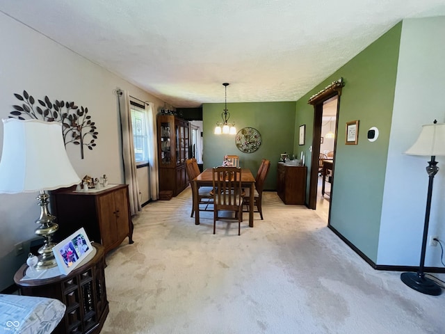 1008 Whispering Trl, Greenfield, IN 46140 - dining room featuring light colored carpet and a chandelier
