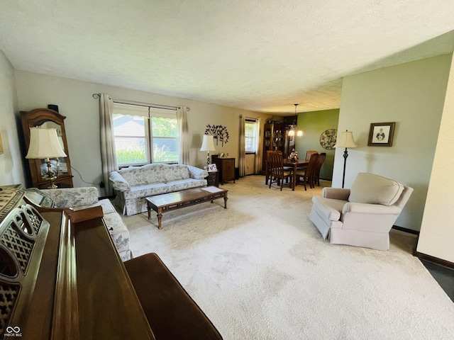 1008 Whispering Trl, Greenfield, IN 46140 - living room featuring light carpet and a chandelier