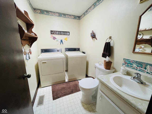 1008 Whispering Trl, Greenfield, IN 46140 - bathroom featuring independent washer and dryer, tile patterned floors, and vanity