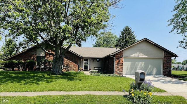 1008 Whispering Trl, Greenfield, IN 46140 - ranch-style home with brick siding, an attached garage, concrete driveway, and a front yard