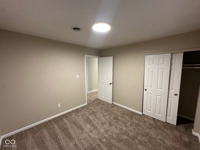 2951 S Elizabeth St, Indianapolis, IN 46203 - unfurnished bedroom featuring carpet flooring and a closet
