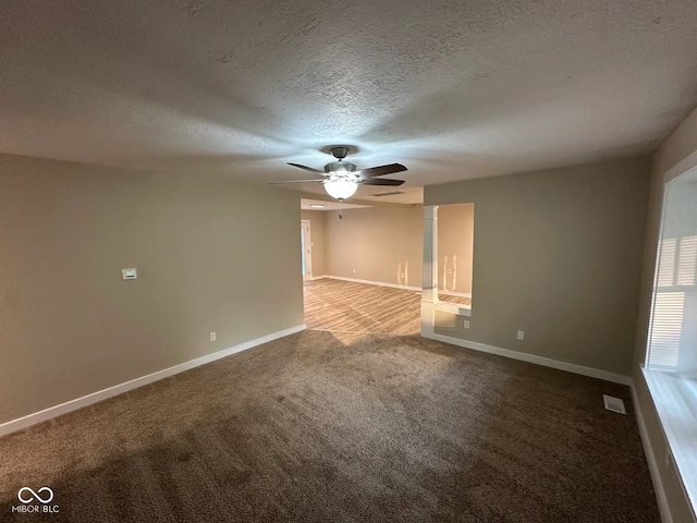 2951 S Elizabeth St, Indianapolis, IN 46203 - carpeted empty room with a ceiling fan and a textured ceiling