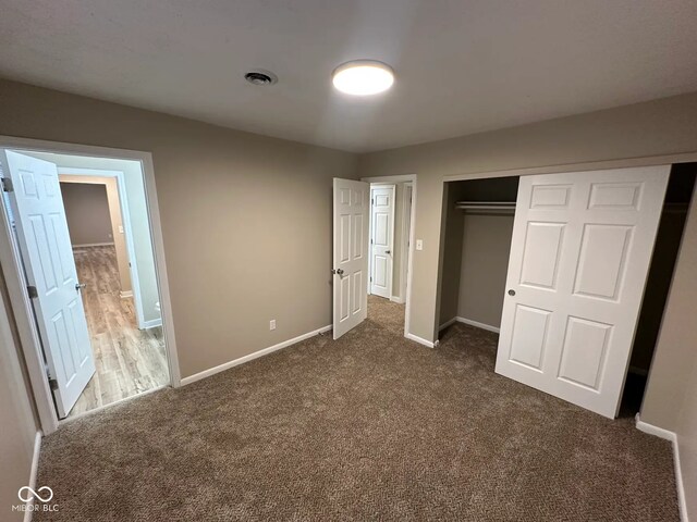 2951 S Elizabeth St, Indianapolis, IN 46203 - unfurnished bedroom featuring carpet floors and a closet