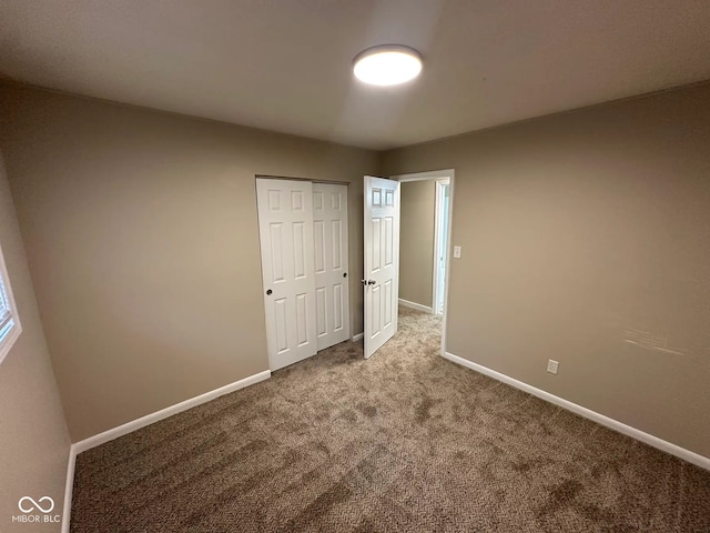 2951 S Elizabeth St, Indianapolis, IN 46203 - unfurnished bedroom with carpet floors and a closet