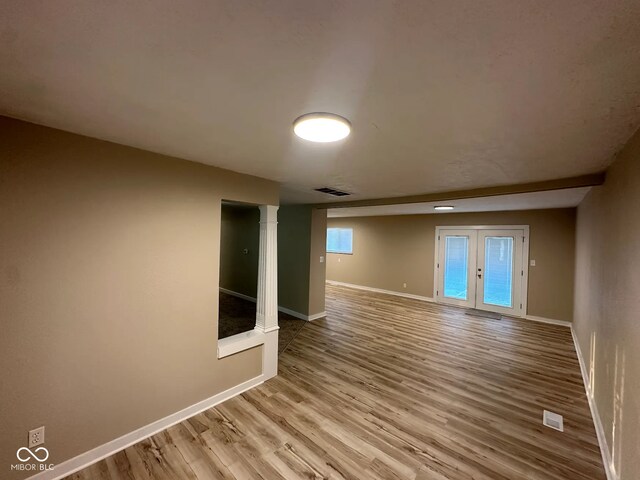 2951 S Elizabeth St, Indianapolis, IN 46203 - spare room with wood finished floors and french doors