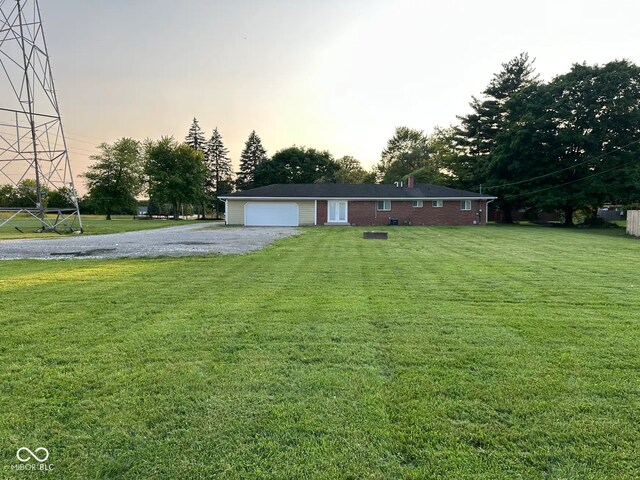 2951 S Elizabeth St, Indianapolis, IN 46203 - ranch-style house with a front lawn and gravel driveway
