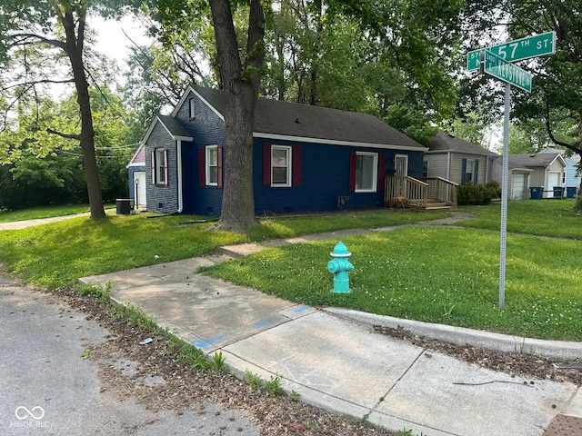 5704 N Keystone Ave, Indianapolis, IN 46220 - view of front facade with crawl space and a front lawn