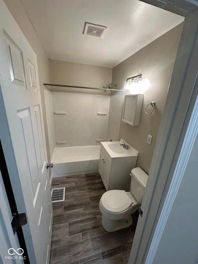 5704 N Keystone Ave, Indianapolis, IN 46220 - bathroom with shower / bath combination, vanity, and wood finished floors
