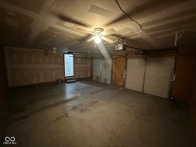 5704 N Keystone Ave, Indianapolis, IN 46220 - garage featuring a garage door opener and a ceiling fan