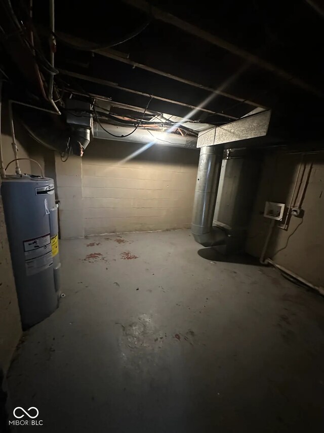 5704 N Keystone Ave, Indianapolis, IN 46220 - unfinished basement featuring water heater