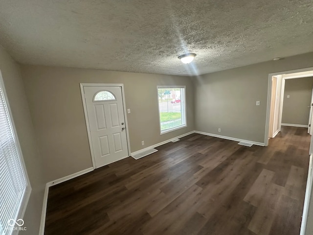 5704 N Keystone Ave, Indianapolis, IN 46220 - entryway featuring dark wood finished floors and a textured ceiling