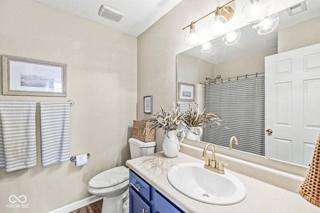 12259 Sweet Creek Trl, Fishers, IN 46037 - full bathroom featuring a textured wall, vanity, a shower with shower curtain, and wood finished floors