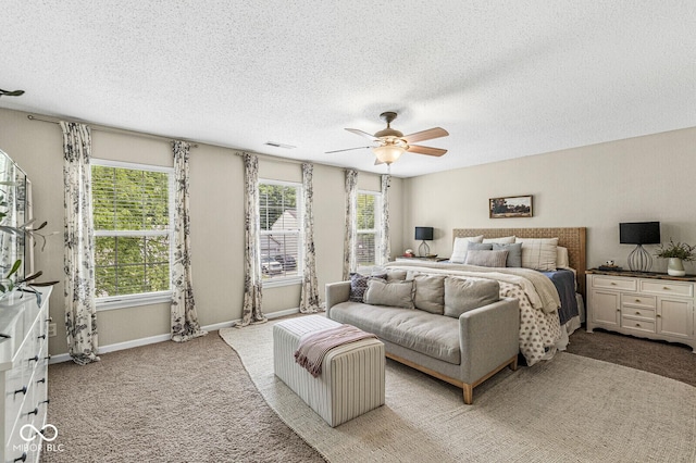 12259 Sweet Creek Trl, Fishers, IN 46037 - bedroom featuring light colored carpet, a textured ceiling, and a ceiling fan